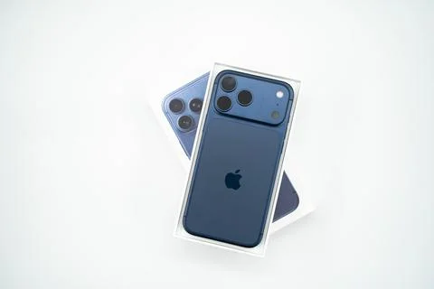 Apple iPhone 17 Pro Max smartphone with retail packaging on white background. Stock Photos
