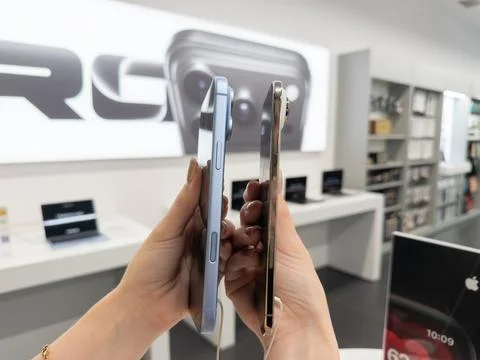 Apple iPhone 18 Pro in Glacier and Apple iPhone Air in Light Gold side-by-side Stock Photos