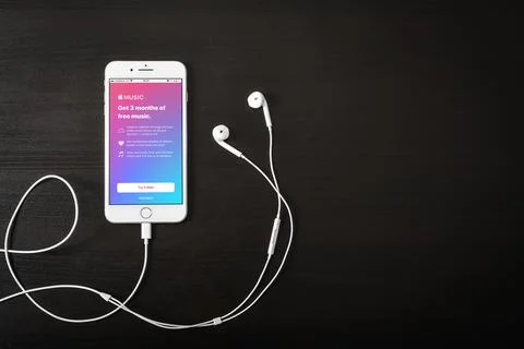 Apple iPhone 8 plus with Apple music app on the screen Stock Photos