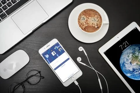 Apple iPhone 8 plus with Facebook app on the screen Stock Photos