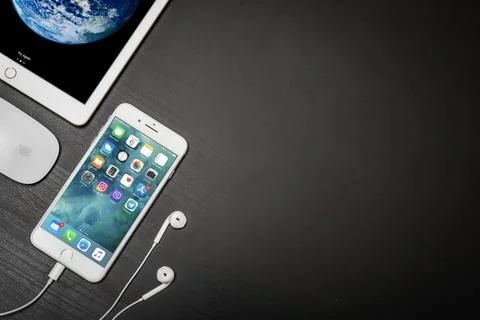 Apple iPhone 8 plus with ipad and computer mouse Stock Photos