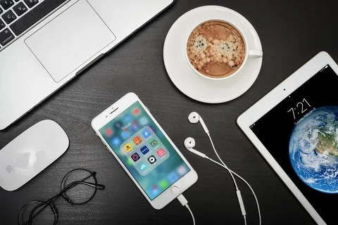 Apple iPhone 8 plus with travel apps on the screen Stock Photos