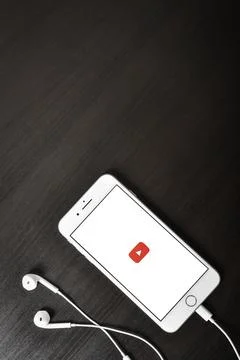 Apple iPhone 8 plus with YouTube app on the screen Stock Photos