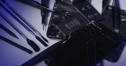Apple iPhone components, replacing damaged parts, display and battery Stock Footage 237390726