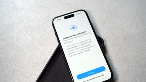 Apple iPhone Screen Showing iOS 26.4.1 software update. Video stock 337761867