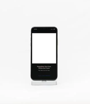 Apple iPhone X smartphone isolated white background tutorial Face ID Stock Photos