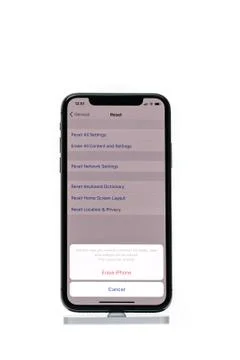Apple iPhone X smartphone isolated white background erease, reset clean data Stock Photos
