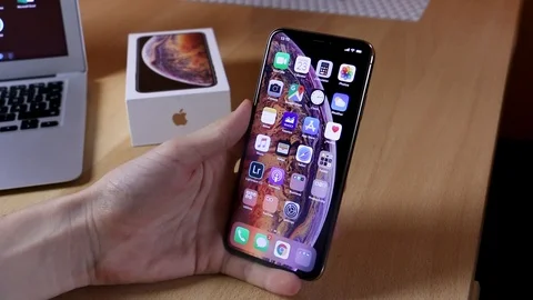 Apple iPhone Xs Max Gold using iOS 12 Stock Footage 102378860