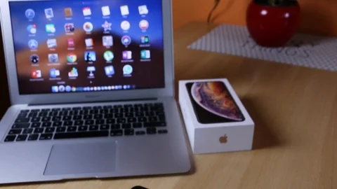 Apple iPhone Xs Max Gold and Apple iPhone 7 Plus Black Comparison Stock Footage 102378863