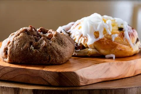Apple jam and sweet bread stuffed and covered with sugar icing. Selective foc Stock Photos