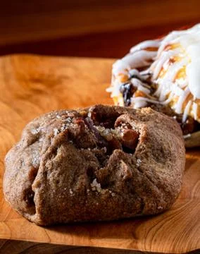 Apple jam and sweet bread stuffed and covered with sugar icing. Selective foc Stock Photos
