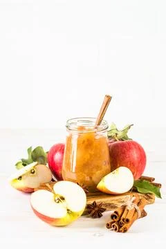 Apple jam with fresh apples on white background. Stock Photos