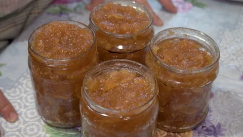 Apple jam in jars Stock Footage 162338313