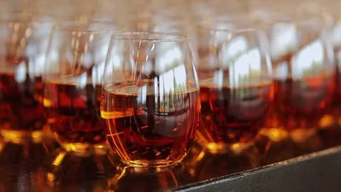 Apple juice in glasses on the table. close-up. glasses with fruity drink. Stock Footage 247880122