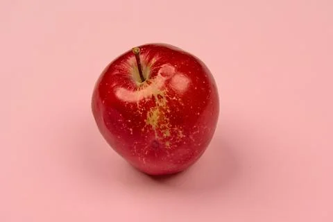 Apple on a light background in the center with space Stock Photos