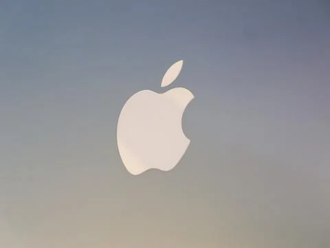 Apple Logo Close-Up on MacBook Pros Surface Stock Photos