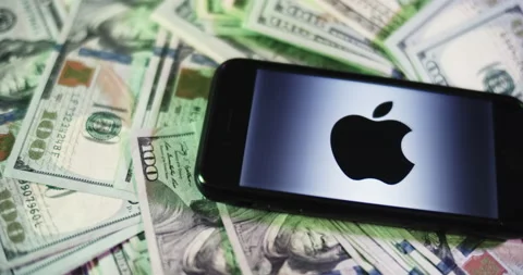 Apple Logo on iphone surrounded by $100 Bills. Apple Profits Layout. Stock Footage 169009004