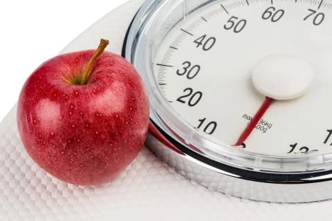 Apple lying on a balance Stock Photos