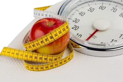 Apple lying on a balance Stock Photos