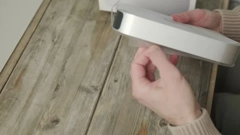 Apple Mac Mini M1 computer held Unboxing, technology portability, working r.. Stock Footage 301135864