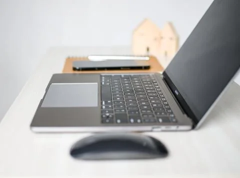 Apple MacBook Pro 13 space grey is power off on desk in the room, save ener.. Stock Photos