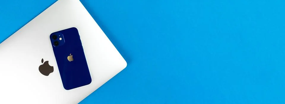 Apple Macbook Pro and modern Apple iPhone together. Banner, Apple production  Foto stock