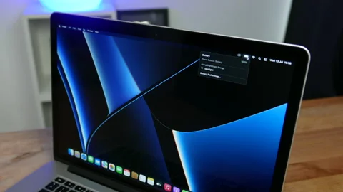 Apple MacBook Pro laptop computer showing battery percentage. Stock Footage 237751266