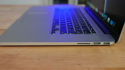 Apple MacBook Pro laptop computer from 2015. Slide right, side view. Stock Footage 237751620