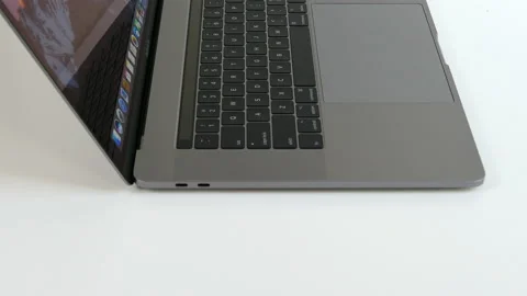 Apple MacBook Pro laptop computer with touch bar. Side view. Stock Footage 237751946