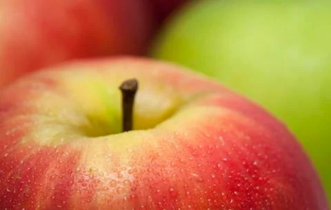 Apple macro with drop of water Stock Photos