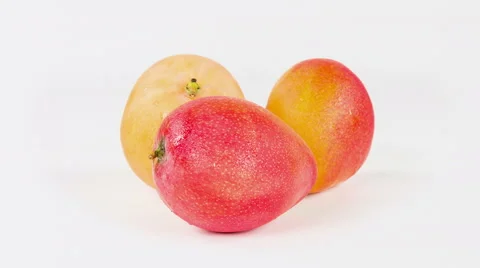 Apple mango isolated on white background, close up rotation. Video stock 63393019
