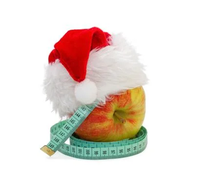 Apple with a measuring meter, in a cap santa claus Stock Photos