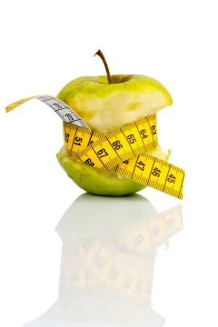 Apple with measuring tape on Stock Photos