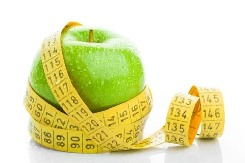 Apple with measuring tape Stock Photos