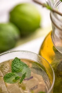 Apple Mojito with Lime, Mint and Cocktail Tube on White Stand. Stock Photos