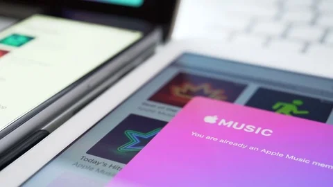 Apple music application on the iPad, iPhone and Macbook display Stock Footage 81209687