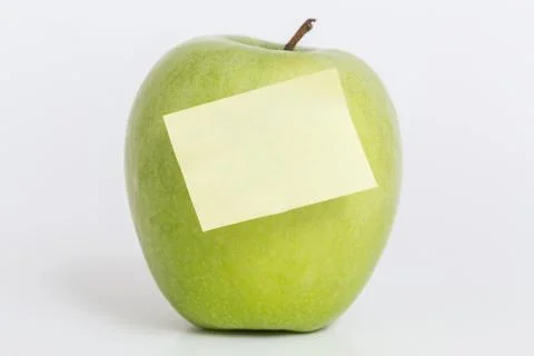 Apple with note and white background Stock Photos