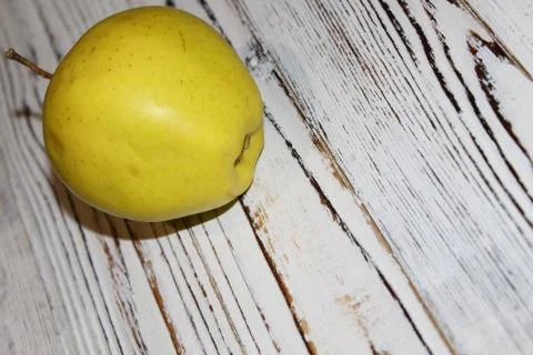 Apple on a old table Stock Photos