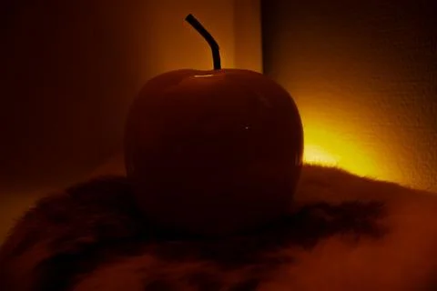 Apple in orange light Stock Photos