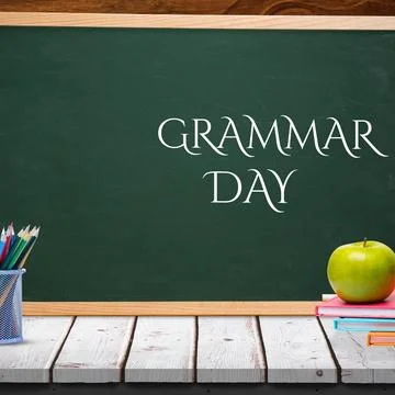 Apple over stack of books on wooden table against grammar day text banner on Stock Photos