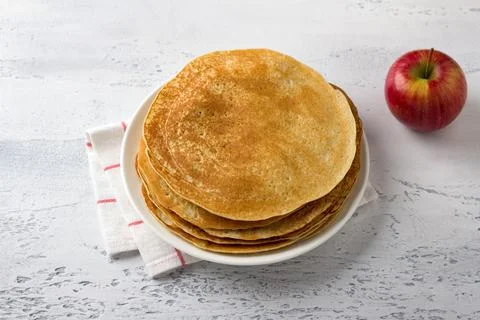 Apple pancakes on a light gray background, top view. Delicious homemade food Photos