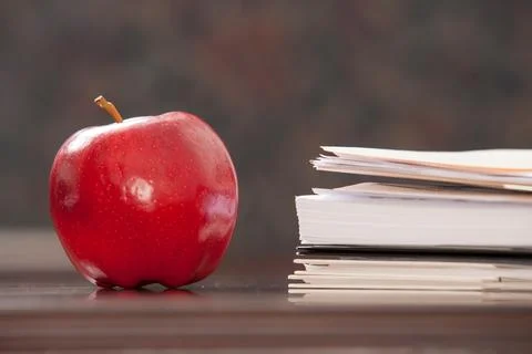 Apple on paperwork Stock Photos