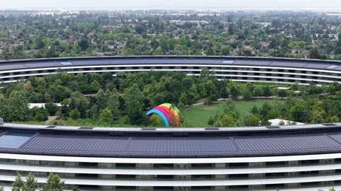 Apple Park circular headquarters rises above dense greenery in Cupertino Видео 339225842