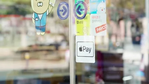 Apple Pay available soon and Apple Pay service sticker at South Korea Video stock 235647803