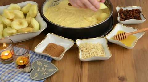 Apple pie baking. Spreading apple slices on the pie dough. Stockbeeldmateriaal 32143290