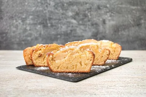Apple pie, cut into equal pieces, sprinkled with powdered sugar Stock Photos