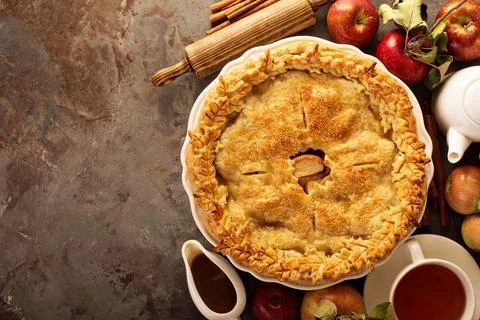 Apple pie decorated with fall leaves Stock Photos