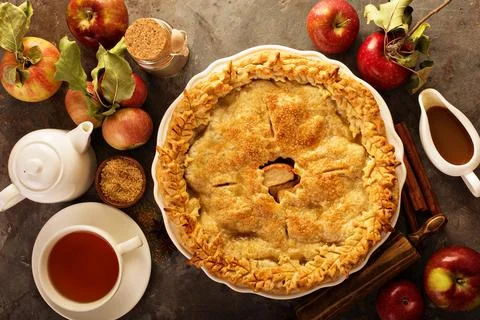 Apple pie decorated with fall leaves Stock Photos