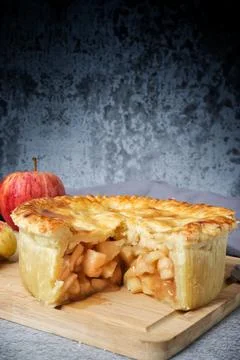 Apple pie with fresh apple on white background Stock Photos
