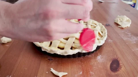Apple pie making process. Painting the tart with egg before baking. Stock Footage 218585765